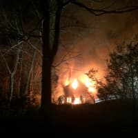 <p>A fire ripped through a two-story home on Shadow Lane in Wilton Thursday night.</p>