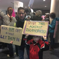 <p>A young protester from Northampton, Mass., with his mom.</p>