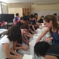 <p>Art students from Maywood participated in a number of workshops, including mask-making.</p>