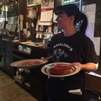 <p>Server Stephanie Corona at Barcelona&#x27;s Restaurant in Garfield. The restaurant serves a host of Italian fare, along with pizza.</p>