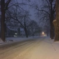 <p>The plows have already been out, but Deer Hill Avenue in Danbury is snow-covered at about dawn on Thursday. A couple of inches of snow are already on the ground, with up to 14 inches possible.</p>