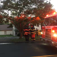 <p>Danbury firefighters work at the scene of a two-alarm blaze at 43 Stadley Rough Road on Tuesday evening.</p>