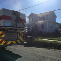 <p>Danbury firefighters at the scene of a blaze at 23 McDermott St. on Friday afternoon.</p>