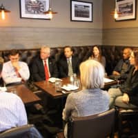 <p>Sen. Chris Murphy, Norwalk Mayor Harry Rilling, State Sen. Robert Duff, and other Norwalk officials and residents listen  during a conversation at Station House restaurant about infrastructure.</p>