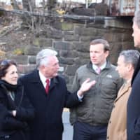 <p>Braving cold and wind, State Rep. Gail Lavielle, Norwalk Mayor Harry Rilling, U.S. Sen. Chris Murphy, State Sen. Bob Duff and State Rep. Fred Wilms discuss needed improvements to the East Norwalk train station and vicinity.</p>