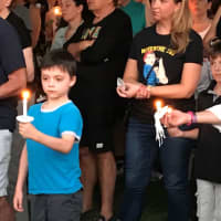 <p>Children and adults attended the candlelight vigil.</p>