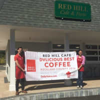 <p>Josh Hansen, left, and Elena Hansen, right, of Red Hill Cafe in New City hold up their DVlicious sign for &quot;Best Coffee in Rockland County.&quot;</p>