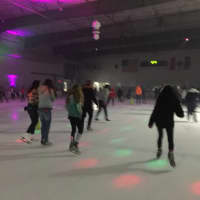 <p>Skaters glide around the rink at the Hackensack Ice House for Skate Jam, every Friday night.</p>