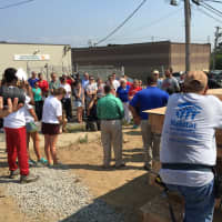 <p>A small crowd gathers as Habitat for Humanity of Coastal Fairfield County holds a wall-raising celebration for the Pope Francis House in Bridgeport on Wednesday.</p>