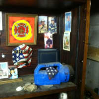 <p>Kees&#x27; wall of memorabilia and the blue flashlight he used on the pile at the World Trade Centers in 2001.</p>