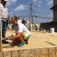 <p>Fairfield University Student Emily Barr works at a Habitat for Humanity construction site in Bridgeport on Wednesday. The new home is being constructed in honor of Pope Francis, who will visit the U.S. later this month. </p>