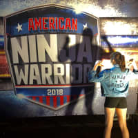 <p>Poalillo rocks her NinjaBabes jacket on the set of American Ninja Warriors.</p>