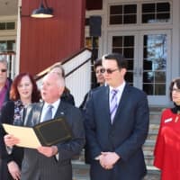 <p>Westport First Selectman James Marpe reads a proclamation designating Nov. 29, 2016 as Giving Tuesday in Westport. Standing on the steps of the Westport Country Playhouse, he is surrounded by representatives of local nonprofits.</p>