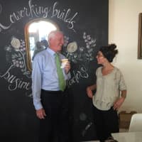 <p>Bridgeport Mayor Bill Finch talks with B:Hive member Callie Heilmann of Hartford Prints! on Thursday, whose cards and products are also sold at B:Hive. </p>