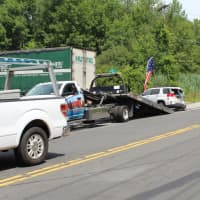 <p>Skyline Towing prepares the car for removal.</p>