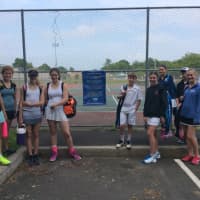 <p>Girls and boys await the start of player at a tournament put on by Slammer Tennis World in Norwalk.</p>