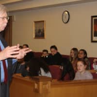 <p>Beacon seventh-grade students listen to Dutchess County Court Judge Peter M. Forman.</p>
