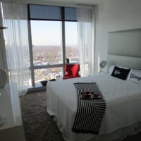 <p>A bedroom in a three-bedroom apartment at &quot;The Modern.&quot;</p>