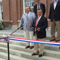 <p>Third Building Committee Chairman Michael T. Averginos and First Selectman Robert E. Mallozzi cut the ribbon on the renovated Town Hall in New Canaan on Saturday. </p>