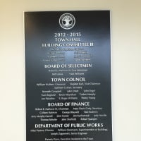 <p>A plaque honoring the third building committee is featured in the new town hall.</p>