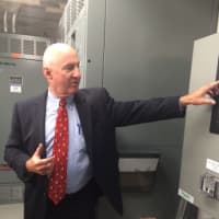 <p>Stephen Whelan, system sales engineer from Schneider Electric, explains Fairfield&#x27;s new microgrid to state and local officials.</p>