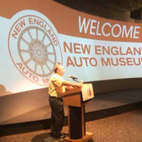 <p>Michael Scheidel, president and CEO of the New England Auto Museum, welcomes guests to a recent fundraiser at Stepping Stones Museum for Children.</p>