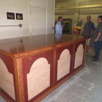 <p>Bill Kelley of Montrose, far right, takes a final look at the altar that three of his wood shop students built at Lincoln Hall Boys&#x27; Haven -- to be used by Pope Francis during this month&#x27;s Mass at Madison Square Garden. </p>