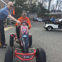 <p>Kids experienced what driving under the influence might feel like. Wearing goggles, they navigated the Pedal Buster and golf cart around traffic cones.</p>