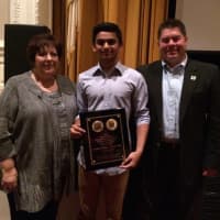 <p>Lodi High School student Urmil Dalal, center, receives his first-place prize with Johanna Gandolfini, sister of &quot;Sopranos&quot; star James Gandolfini, and Tom Richardson at Fort Lee High School Nov. 7.</p>