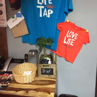 <p>Brick + Wood has a fun vibe and t-shirts that read &quot;life on tap.&quot; </p>
