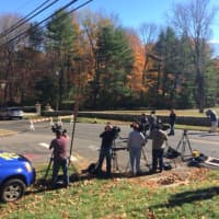 <p>Media wait near the house on Norfield Road where police found what may be human remains</p>