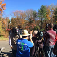 <p>Media swarm around Erin Moore, who knew Jeannette Navin of Easton, who has been missing along with her husband Jeffrey Navin since August.</p>