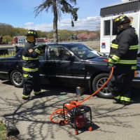 <p>Westport firefighters do a demonstration of the Jaws of Life at the Maker Faire.</p>