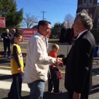 <p>GOP mayoral hopeful Enrique Torres greets voters outside Black Rock School.</p>