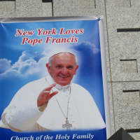 <p>A poster above Holy Family Church near the United Nations in Manhattan anticipates Thursday&#x27;s arrival of Pope Francis as part of his United States tour.</p>