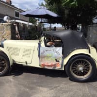 <p>Clark Hanford regularly drives this antique British sports car, a 1932 MG.</p>