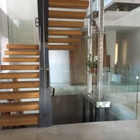 <p>Right in the main entrance is the stairwell which will soon have an aquaponic garden tower with plants and a fish tank in the basement.</p>