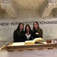 <p>Mamaroneck High School senior Sophia Danziger, middle; Lauren Pogostin, left, and Marie Amelie Morang, co-presidents of the school’s Future Business Leaders of America club, rang the bell at the New York Stock Exchange.</p>