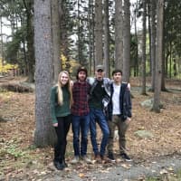 <p>Intern Kristen Jajko, former intern John Curnyn, and interns Liam Hickey and Kyle Fedele stand together on the Weis property in Ringwood.</p>