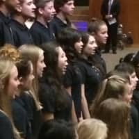 <p>The Trumbull High School Chamber Singers sing the national anthem at the 2015 Veterans Day ceremony.</p>