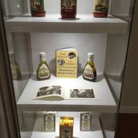 <p>Newman&#x27;s Own Foundation shows a display of how it all started — with the actor&#x27;s own salad dressing. </p>