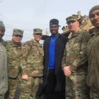 <p>Military members from the Teaneck Armory with NY Giants player Michael Cox.</p>