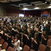 <p>Trumbull High School seniors offer Brookfield Police Chief Robin Montgomery a standing ovation at the 2015 Trumbull Veterans Day ceremony.</p>