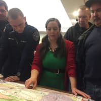 <p>HR Coordinator Liz Twiggs maps out a course of action for Operation Santa Boone.</p>
