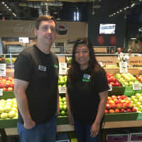 <p>Dan Gormely of Easton and Suzi Robinson of Massachusetts pose in front of the produce section at the new bFresh supermarket in Fairfield Wednesday.</p>