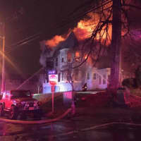<p>Firefighters were ordered out of the house when smoke and fire began engulfing the house, bringing the blaze to a third alarm.</p>