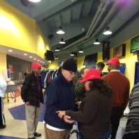 <p>A guest, left, prays with a volunteer at Bridgeport Rescue Mission&#x27;s Great ThanksGiving Project. </p>