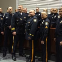 <p>Members of the Little Falls Police Department come together during a swearing-in ceremony for the new chief and lieutenant Monday, Dec. 7.</p>