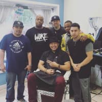 <p>Jaybee Flores, seated, with other Cut Creations originals.</p>