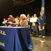<p>Stratford Mayor John Harkins and School Superintendent Janet Robinson shake hands after he vetoed the town budget on Thursday at Bunnnell High School.</p>
